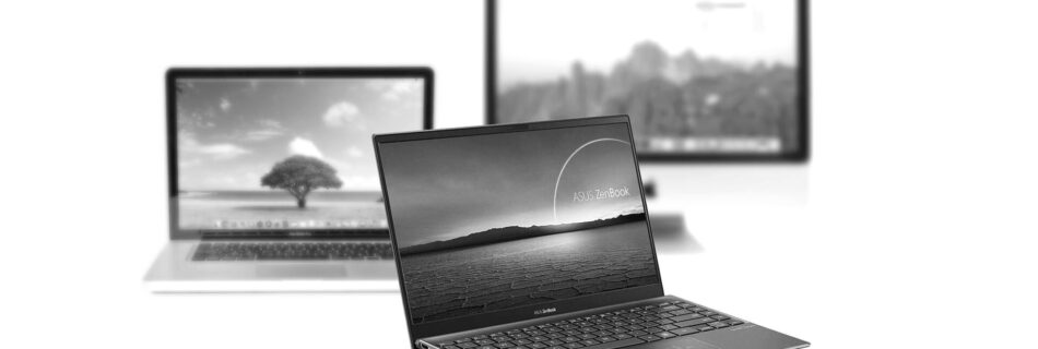 Photo montage of Asus laptop in front and blurred Macbook Pro and iMac in the background.