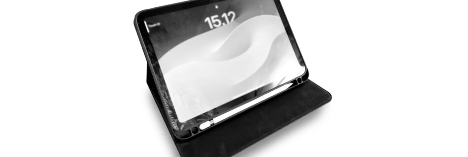 iPad inside a case, set on table screen up.