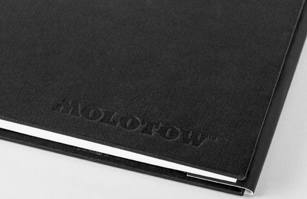 An engraving on a black book cover.